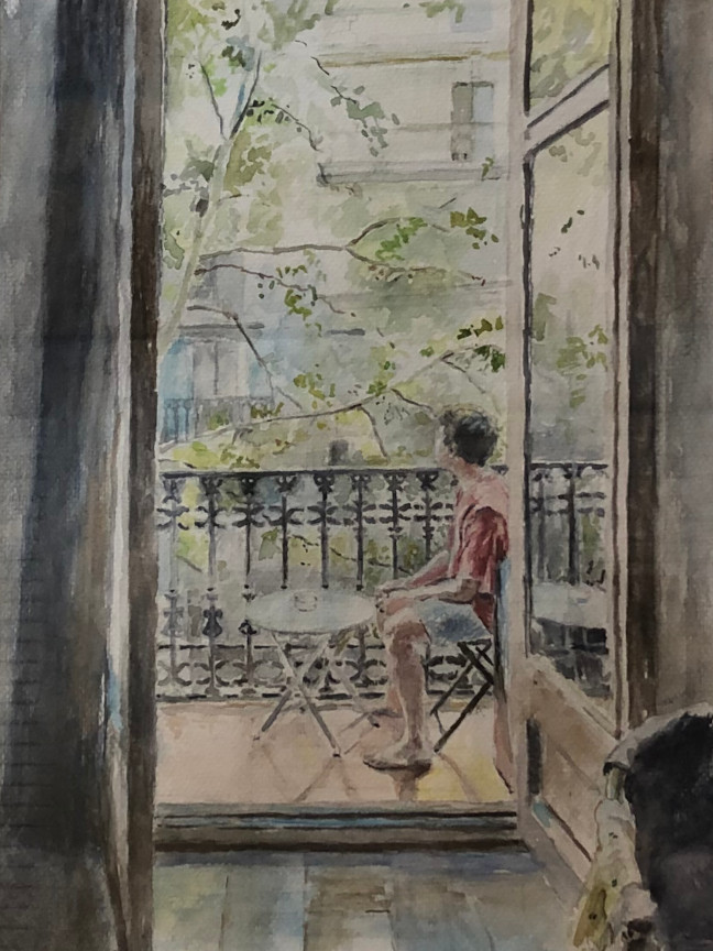 boy sitting on balcony